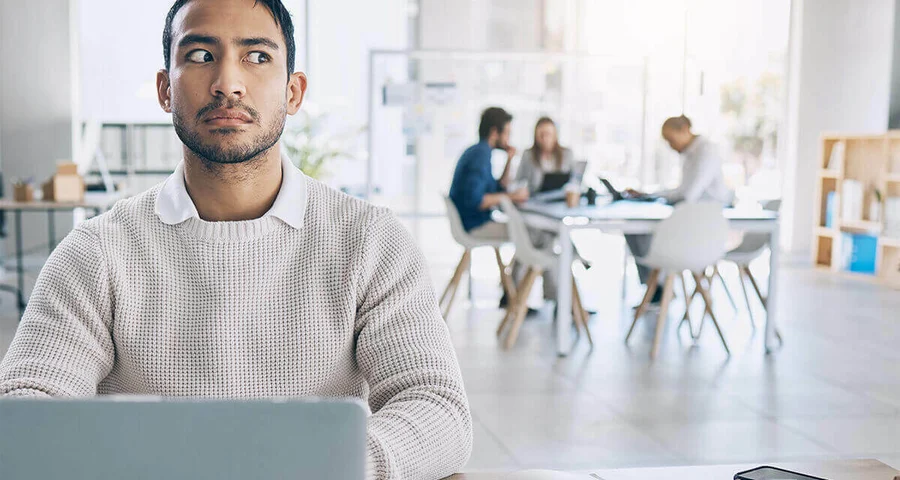 suspicious worker listening to co-workers in a breakroom