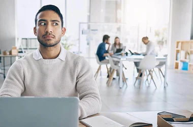 suspicious worker listening to co-workers in a breakroom