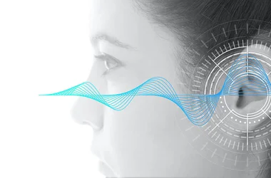 soundwave superimposed over an ear depicting hearing test
