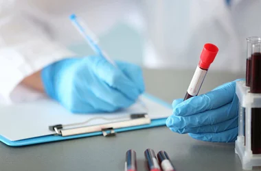 medical technician recording blood titer results