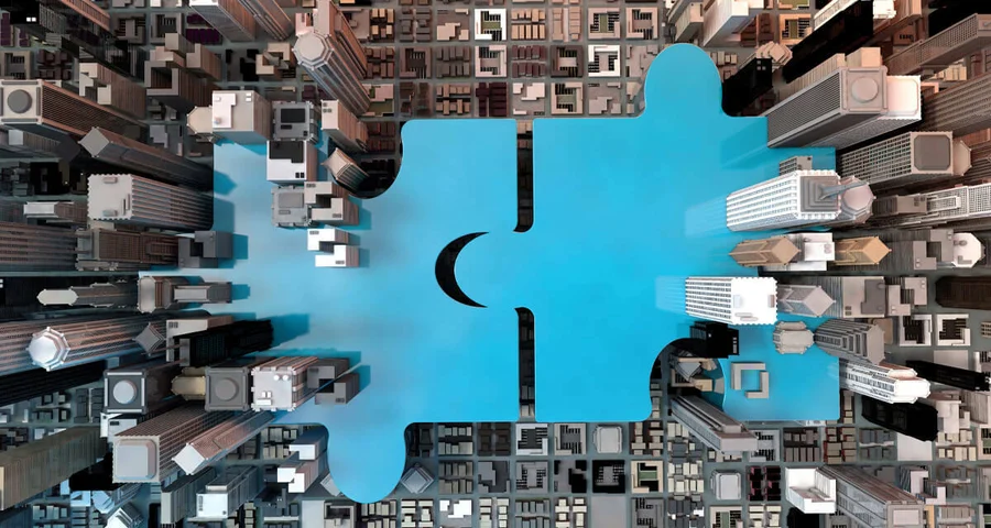 Illustration: Two cities joining together as puzzle pieces.