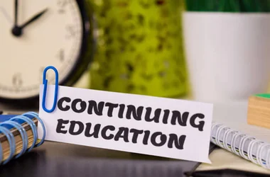 Continuing Education on piece of paper on a desk