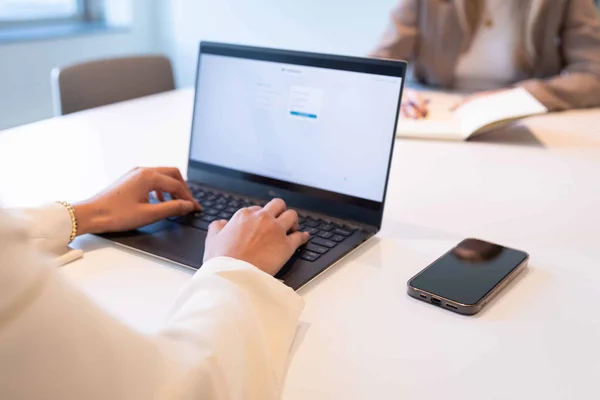 close up of someone typing on their laptop