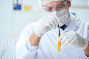 Lab technician performing a drug test in a test tube