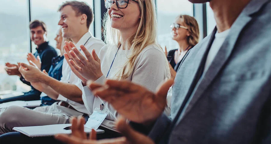 audience clapping at a conference