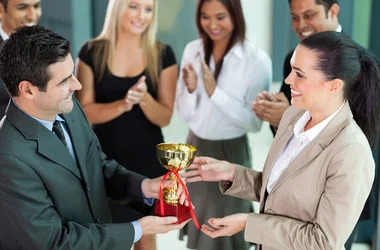 Background check award being presented between professional business people