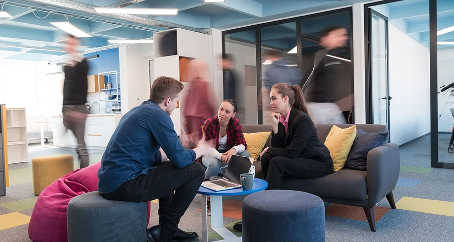 A group of employees sitting and having a discussion