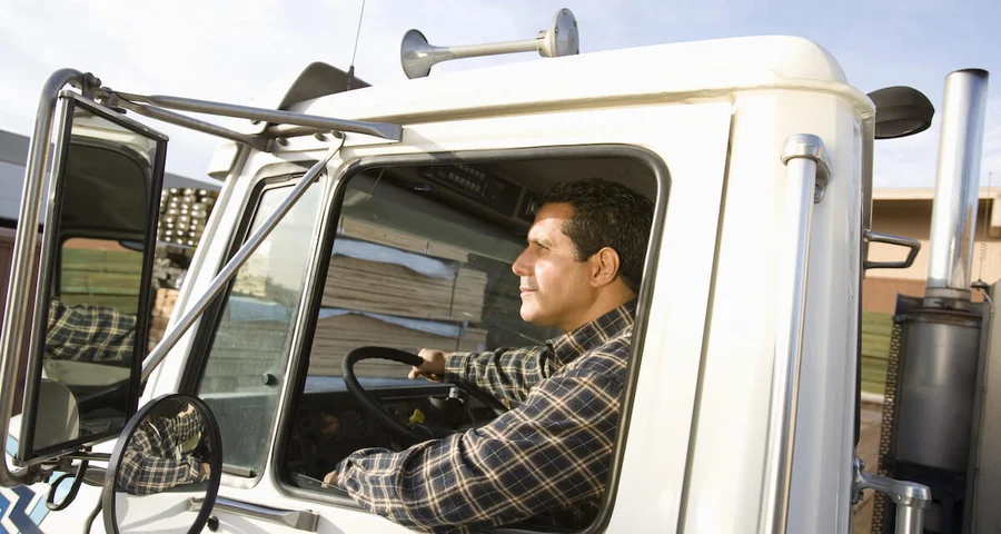 Truck driver driving with the window down
