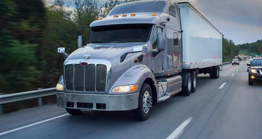 Long Haul Transportation truck driving across state on highway
