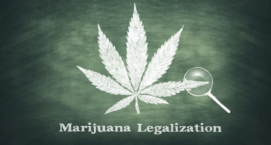 Marijuana leaf on a green chalkboard