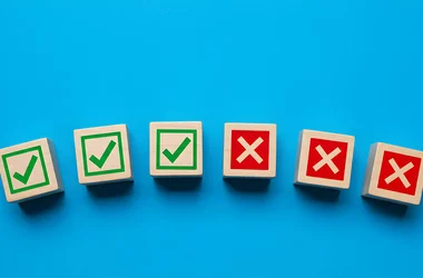 3 wooden blocks with green check marks and 3 wooden blocks with red x marks on a blue background