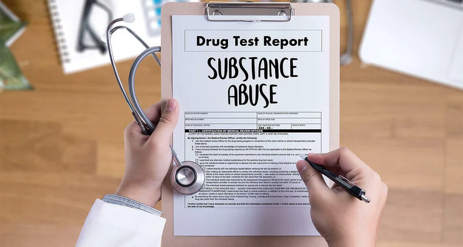 doctor holding a clipboard with a Substance Abuse Report form