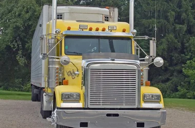 yellow big rig with white trailer