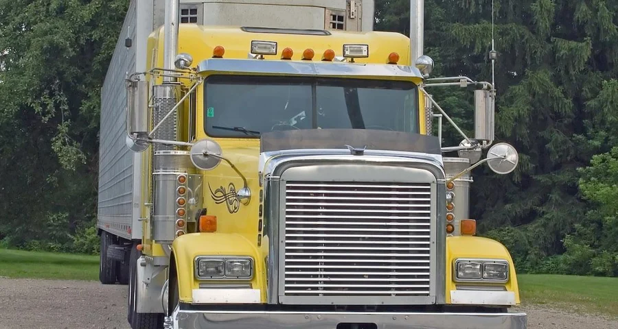 yellow big rig with white trailer