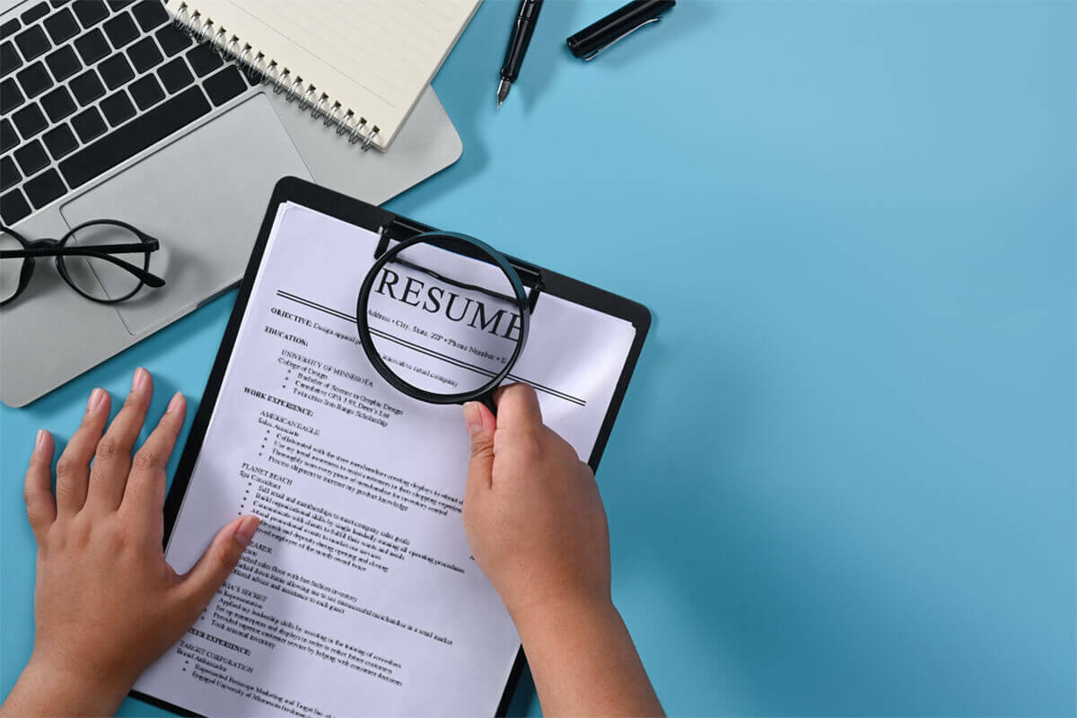 employee background check magnifying resume