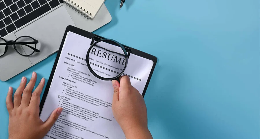 employee background check magnifying resume