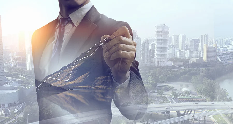 company growth businessman pointing at chart