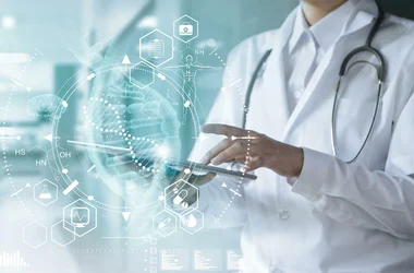 Doctor using a tablet to view patient details