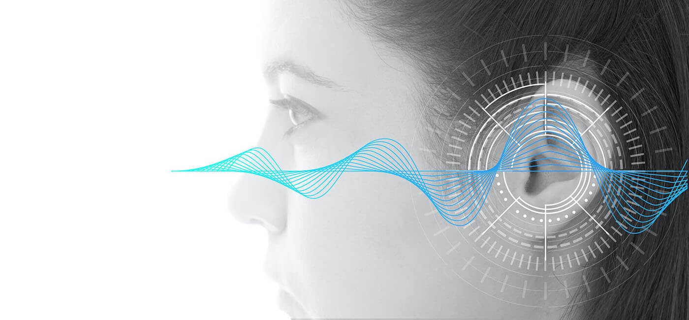 soundwave superimposed over an ear depicting hearing test