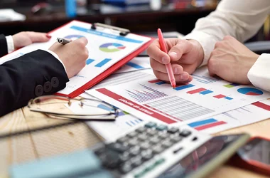 Group of people reviewing document in preparation for an audit