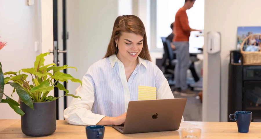 Woman at laptop looking up driving licence records