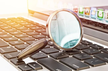 Magnifying glass on a keyboard