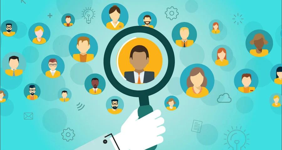Magnifying glass highlighting a candidate for employment