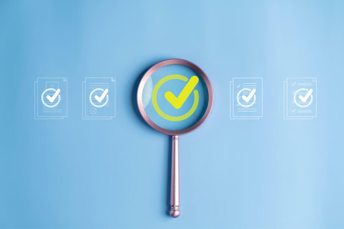 magnifying glass highlighting a check mark