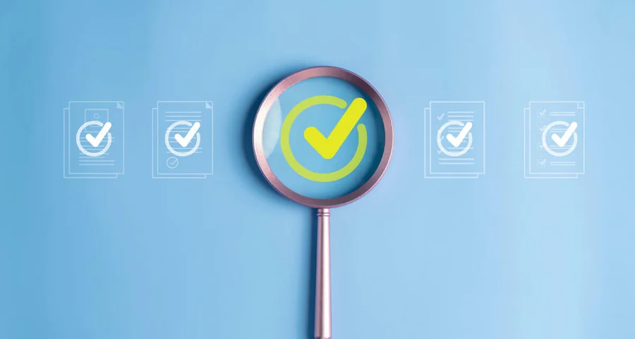 magnifying glass highlighting a check mark