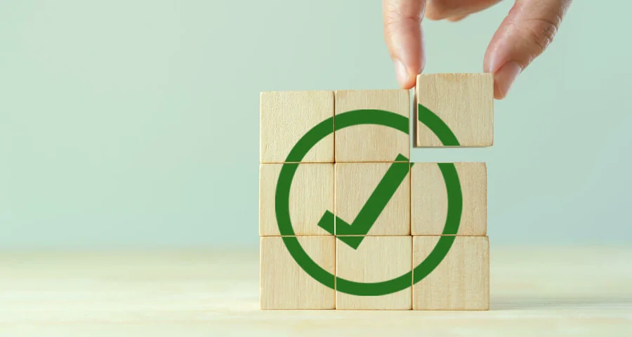 legal compliance wooden block check mark