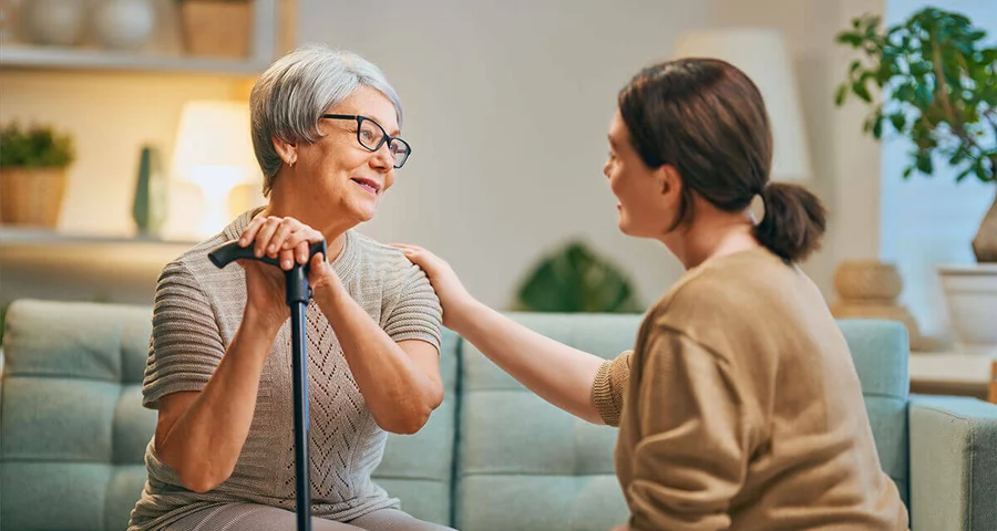Caregiver assisting woman