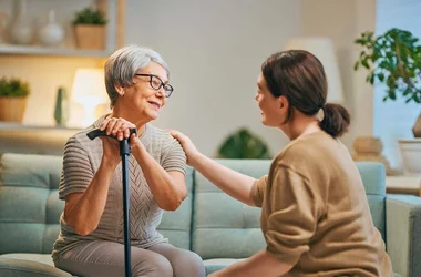 Caregiver assisting woman