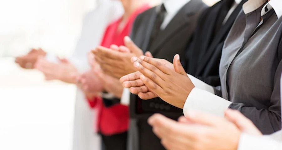 business people clapping hands