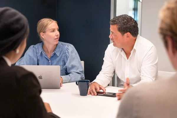 Colleagues meeting in a conference room