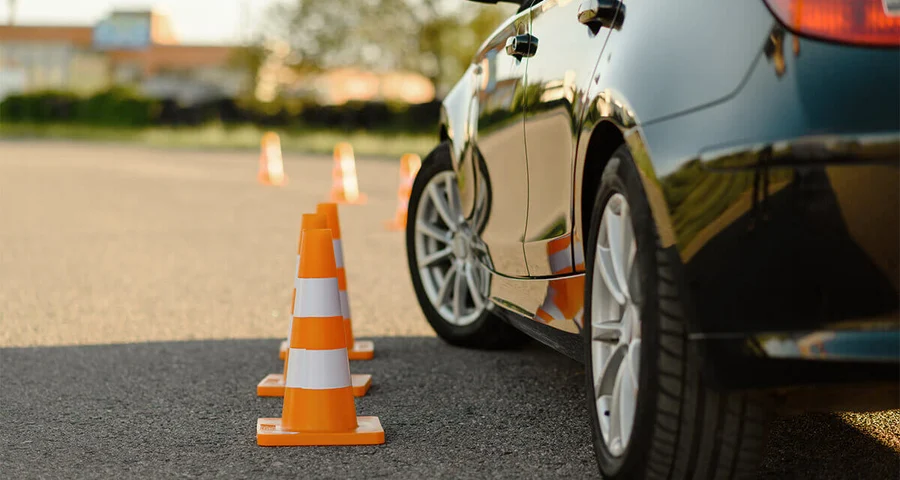 driving test car with safety cones