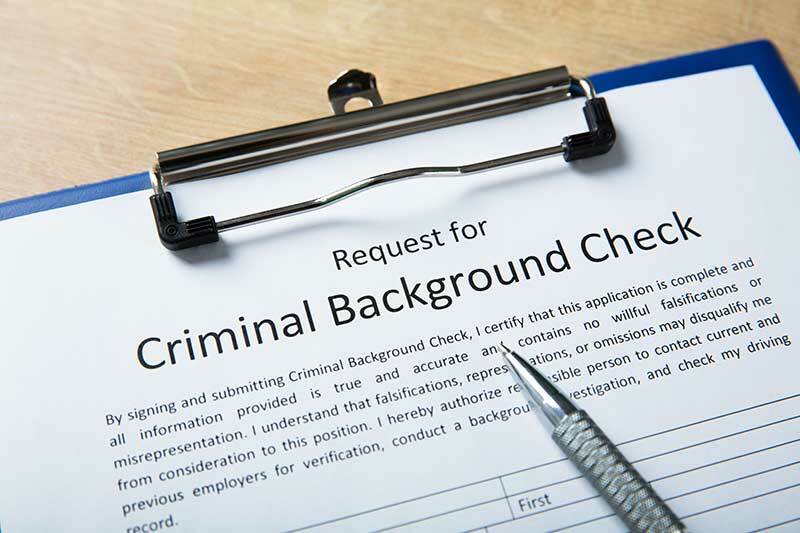 Criminal Background check form on a clipboard
