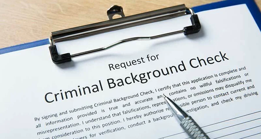 Criminal Background check form on a clipboard