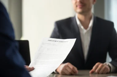 Future employee reads employment contract
