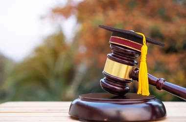 Graduation diploma hat and judge gavel