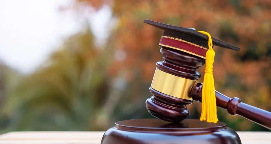 Graduation diploma hat and judge gavel