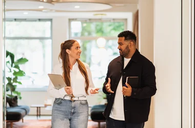 Two colleagues laughing