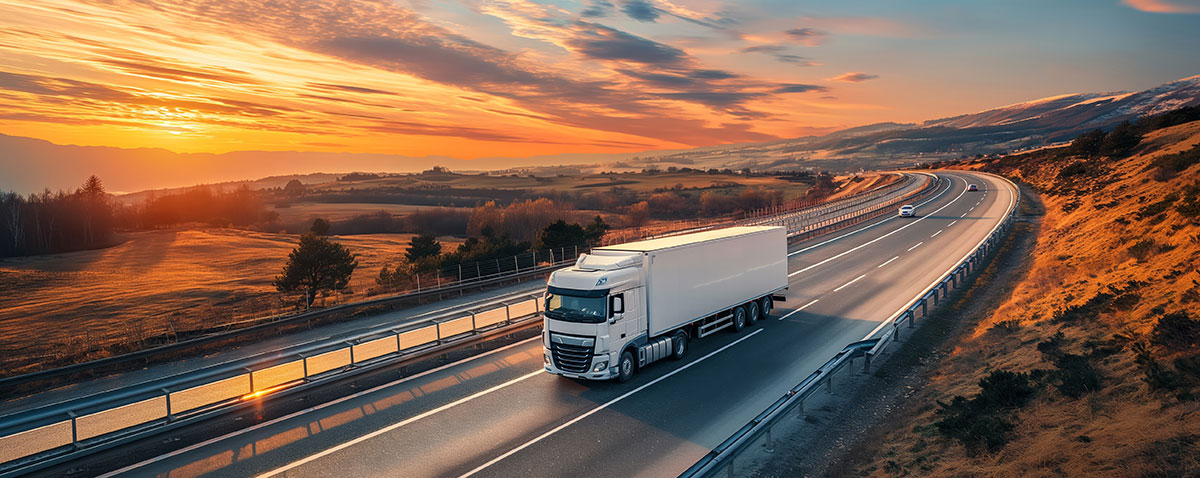 Refrigerated truck on highway, transporting perishables