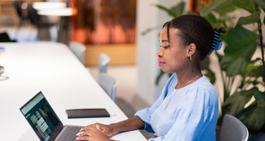 employee working on her laptop in the office