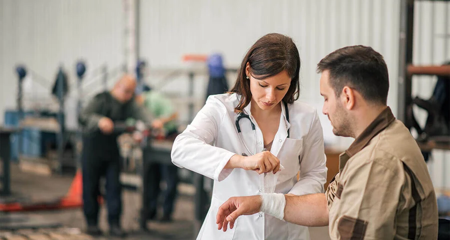 onsite health clinic nurse and patient