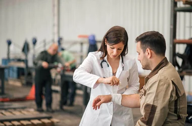onsite health clinic nurse and patient