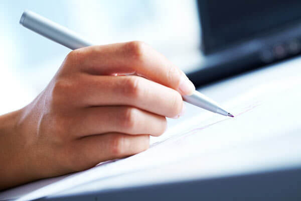 hand writing with a pen