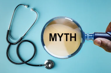 magnifying glass over the word myth and stethoscope