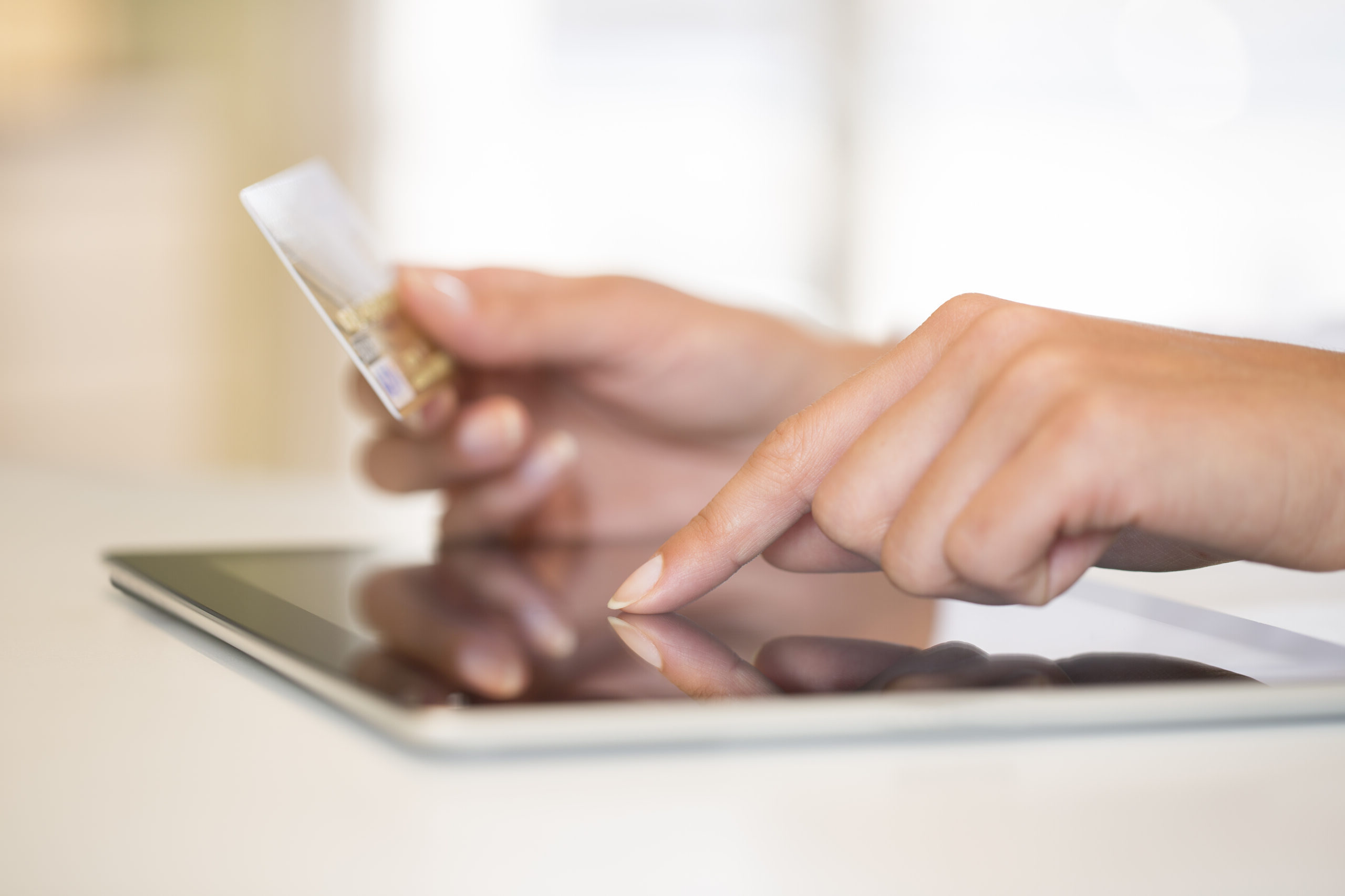 woman entering credit card information online
