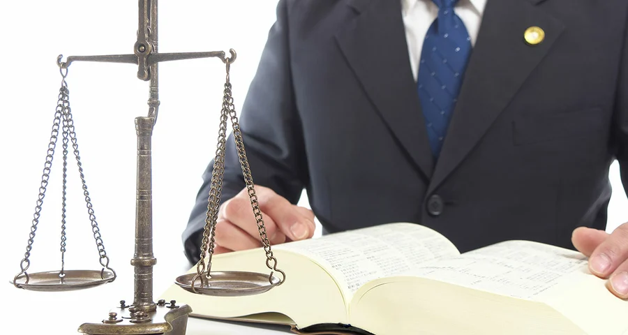 man in suit legal scales of justice
