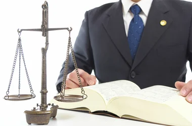 man in suit legal scales of justice